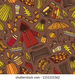 Cute autumn seamless pattern with hand drawn doodle autumn elements. Concept of cozy autumn.