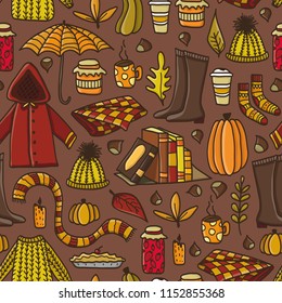 Cute autumn seamless pattern with hand drawn doodle autumn elements. Concept of cozy autumn.