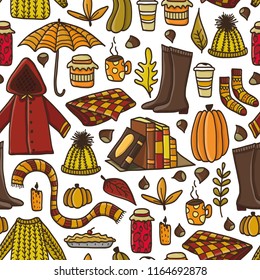 Cute autumn seamless pattern with hand drawn doodle autumn elements. Concept of cozy autumn.
