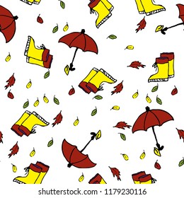 Cute autumn seamless pattern with a set of colored flat umbrellas, leafs and rubber boots