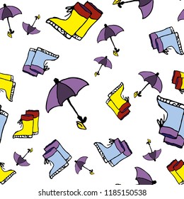 Cute autumn seamless pattern with a set of colored flat umbrellas and rubber boots
