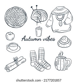 Cute autumn set of doodles cozy autumn with  candles, pie, sinabon,  cinnamon, sweater, socks. 