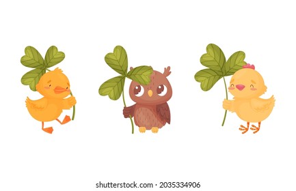 Cute baby animals with three leaf clover set. Adorable chickens, owlet holding shamrock leaves cartoon vector illustration