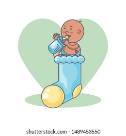 cute baby boy with bottle milk and sock