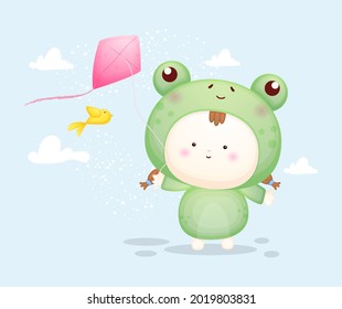 Cute baby in frog costume playing kites. Mascot cartoon illustration Premium Vector