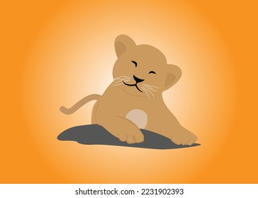 cute baby lion relaxing on a rock