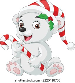 Cute baby polar bear holding candy cane