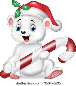 Cute baby polar bear holding Christmas candy