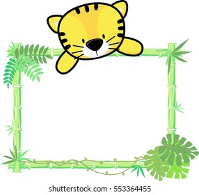 cute baby tiger on blank board with bamboo frame isolated on white background