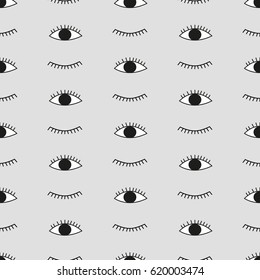 Cute background for kids fabric design made on cartoon style. Vector hand drawn seamless pattern with open and winking doodle eyes.  Seamless vector background