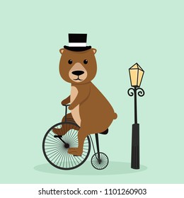 Cute bear riding a bycicle