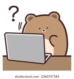 A cute bear tilting its head in front of a computer