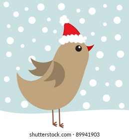 Cute bird in Santa hat in winter scenery