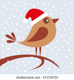 Cute bird sitting on branch in the winter