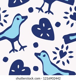 Cute birds and hearts folk art seamless vector pattern in indigo, light blue and white. Great for textiles, stationery, kids fashion, home decor, gift wrapping paper, print on demand and scrapbooking.