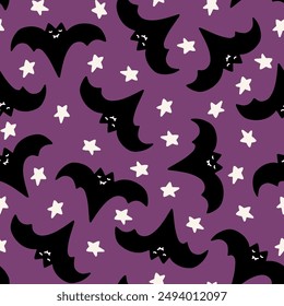 Cute black bats and white stars on purple background seamless repeat pattern. Halloween holiday cartoon style design for paper, textile, wallpaper, stationery design.