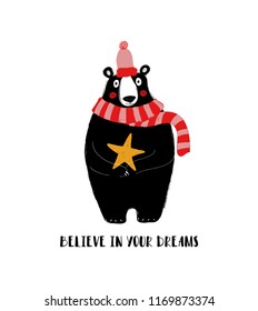 Cute black bear holding a star. Greeting card with inspiring phrase: believe in your dreams.