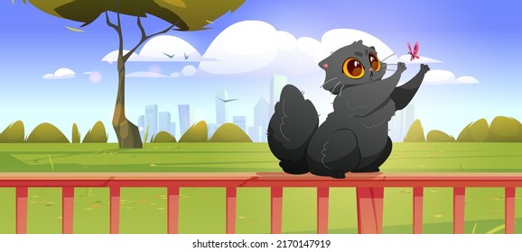 Cute black cat catching butterfly on wooden fence. Vector cartoon illustration of summer landscape of backyard or garden with green grass, trees, city on horizon and funny kitten playing on railing