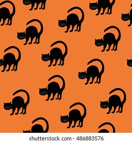 Cute black cat on the orange background halloween seamless pattern.Vector illustration