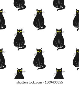 Cute black cats vector seamless pattern. White background.