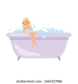 Cute blonde girl is taking a bath and talking on telephone