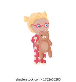 Cute blonde kid in glasses holds her soft toy. Happy girl hugs a bear toy. Flat design. Cartoon design.