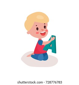 Cute blonde little boy sitting on the floor playing with letter A, kid learning through fun and play colorful cartoon vector Illustration
