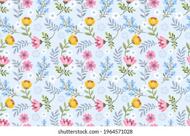 Cute blooming small flowers on blue background seamless pattern.