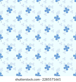 Cute blue clovers are surrounded by small blue clovers background, a seamless pattern that looks beautiful, bright and attractive.