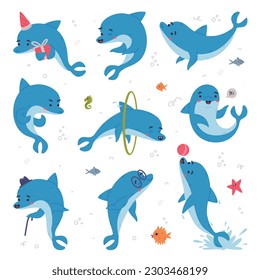 Cute blue dolphins set. Funny happy underwater animals performing tricks in dolphinarium cartoon vector illustration svg