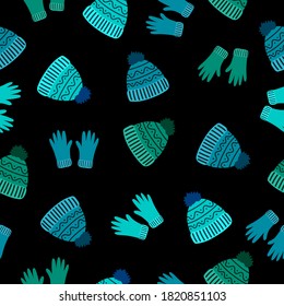 Guantes azules y verdes, sombreros de lana sobre fondo negro. Moda de ropa íntima de invierno sin foco. Adecuado para embalaje, textil, papel pintado.