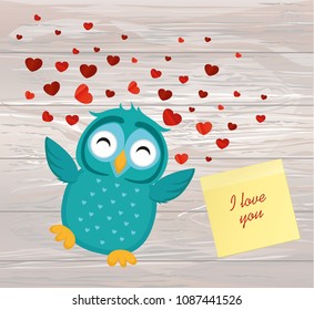 Cute Blue Owlet happy smiles and spreads wings hearts up. Yellow sheet of paper for notes. Sticker. Greeting card for Valentine's Day. Vector illustration on a wodden background.