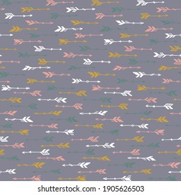 Cute boho arrows graphic seamless ornament. Ethnic rustic design. Indigenous american motif. Bohemian arrows illustration. Boys room wallpaper pattern. Hunting objects.