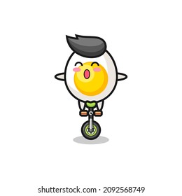 The cute boiled egg character is riding a circus bike , cute style design for t shirt, sticker, logo element