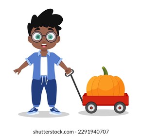 Niño lindo con calabaza grande
