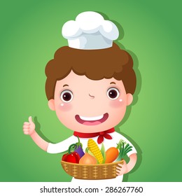 Cute boy chef holding a basket of vegetables and showing thumbs up