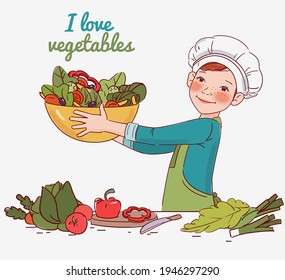 Cute boy cooking salad in the kitchen