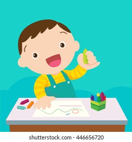 cute boy drawing with colorful pencils