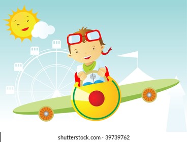 Cute boy driving plane at the carnival