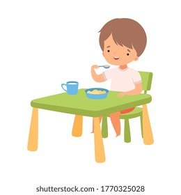 Cute Boy Eating Breakfast at the Table, Preschool Kid Daily Routine Activity Cartoon Vector Illustration