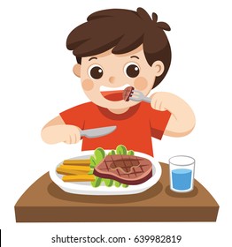 A cute boy is eating steak with vegetables for a lunch.