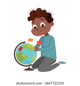 Cute Boy Examining Globe and Putting Flags on It Studying Geography Vector Illustration