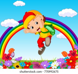 Cute boy in a flower garden with rainbow