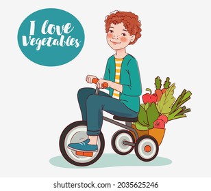 Cute boy with fresh vegetables rides on bicycle in the garden. Summer time