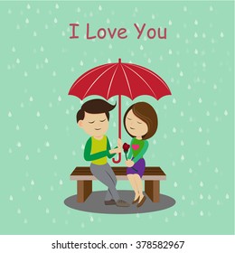 Cute boy and girl sweet with umbrella in the rainy season