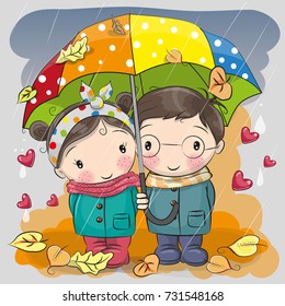 Cute Boy and girl with umbrella under the rain