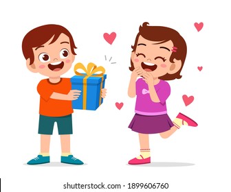 cute boy give present to little girl for celebrate birthday