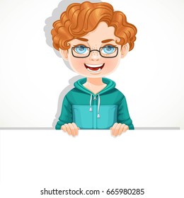 Cute boy in glasses holds large white horizontal banner on a white background