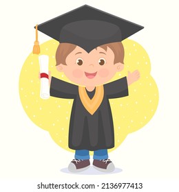 Cute boy graduates, dressed in cap and gown, with diploma in hand.