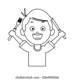 Cute boy holding cutlery